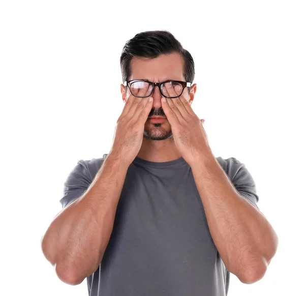 Young man with glasses covering eyes on white background — Stock Photo, Image