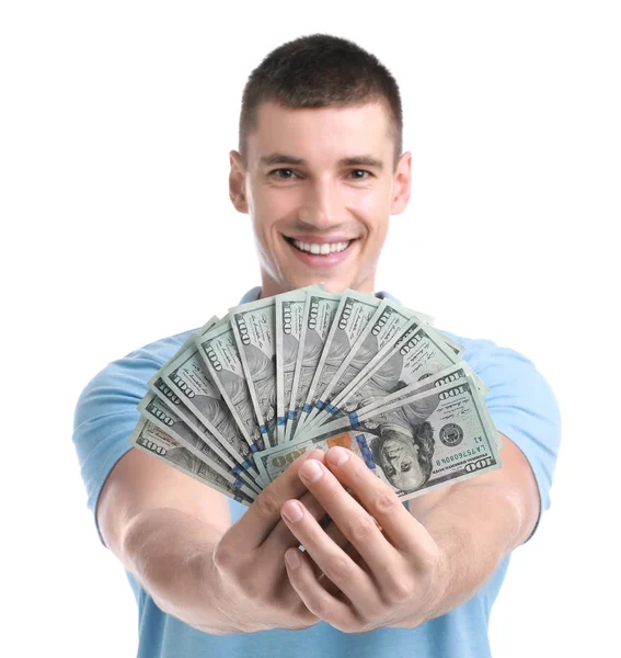 Handsome young man with dollars on white background — Stock Photo, Image