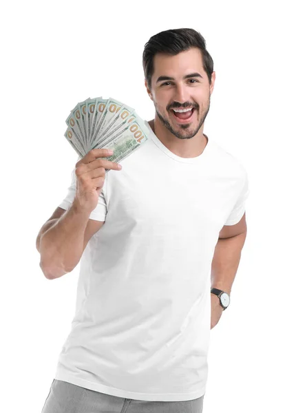 Schöner junger Mann mit Dollars auf weißem Hintergrund — Stockfoto