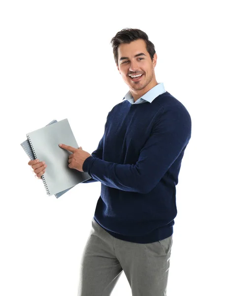 Молодий вчитель чоловічої статі з блокнотами на білому тлі — стокове фото