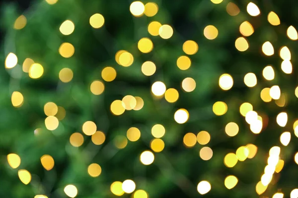 Fundo abstrato com luzes de Natal amarelas borradas, efeito bokeh — Fotografia de Stock