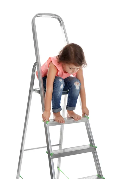 Little girl sitting on ladder on white background. Danger at home — Stock Photo, Image