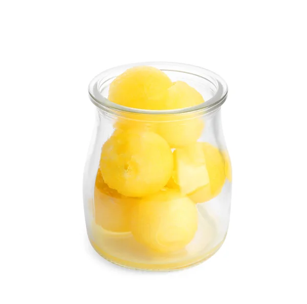 Frasco de vidro de bolas de melão no fundo branco — Fotografia de Stock