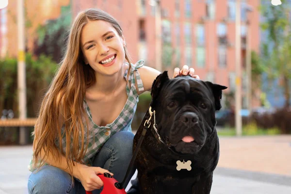 Young woman with American Staffordshire Terrier dog outdoors — Stock Photo, Image