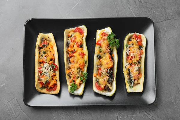Delicious stuffed zucchini on grey table, top view — Stock Photo, Image