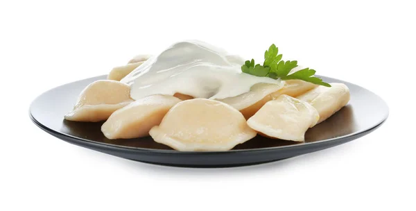 Delicious cooked dumplings with sour cream on white background — Stock Photo, Image