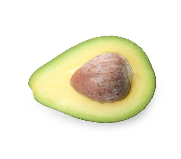 De helft van de rijpe avocado met pit op witte achtergrond — Stockfoto