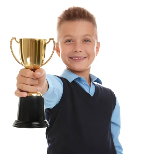 Happy boy in school uniform met gouden winnende Cup geïsoleerd op wit — Stockfoto