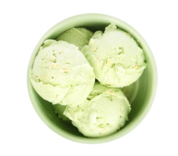 碗美味的开心果冰淇淋在白色背景，顶视图 — 图库照片
