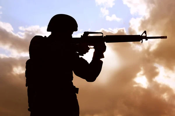 Soldier with machine gun patrolling outdoors. Military service — Stock Photo, Image