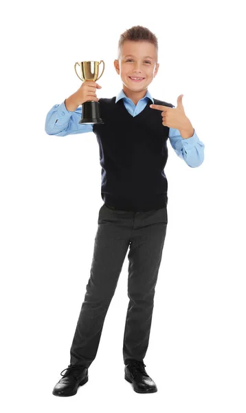 Happy boy in school uniform met gouden winnende Cup geïsoleerd op wit — Stockfoto