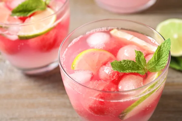 Tasty refreshing watermelon drink on wooden table, closeup — Stock Photo, Image