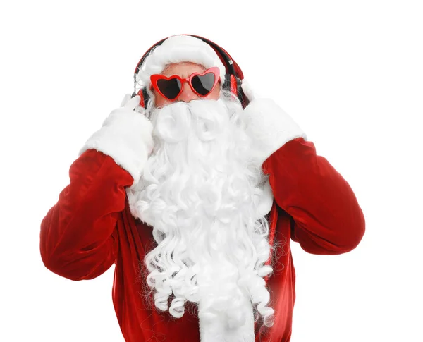 Papai Noel ouvindo música de Natal em fundo branco — Fotografia de Stock