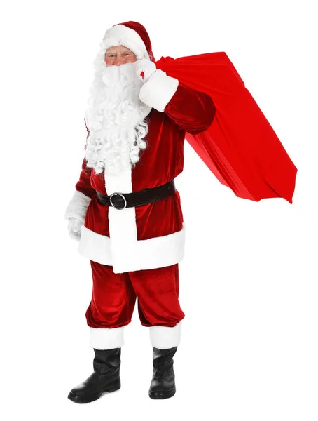 Настоящий Санта-Клаус с сумкой, полной подарков на белом фоне — стоковое фото
