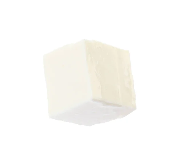 Pedazo de delicioso queso feta sobre fondo blanco — Foto de Stock