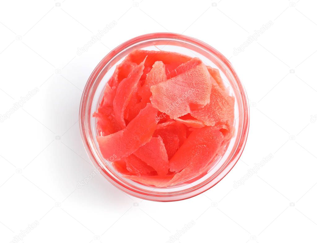 Piquant pickled ginger in bowl on white background, top view.  Delicious sauce condiment