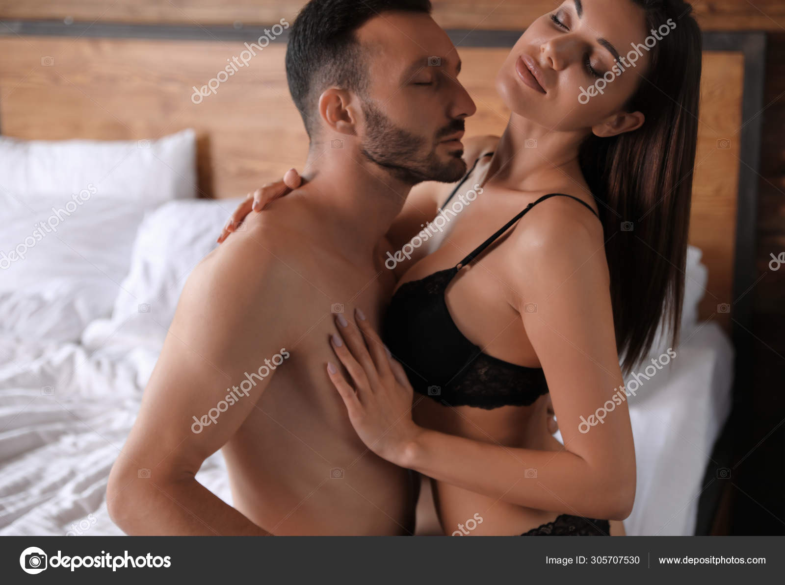 Passionate young couple having sex in bed at home Stock Photo by ©NewAfrica 305707530 photo