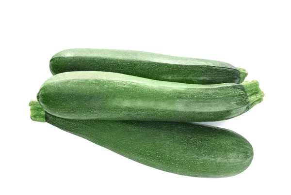 Frische reife grüne Zucchinis isoliert auf weiß, Draufsicht — Stockfoto