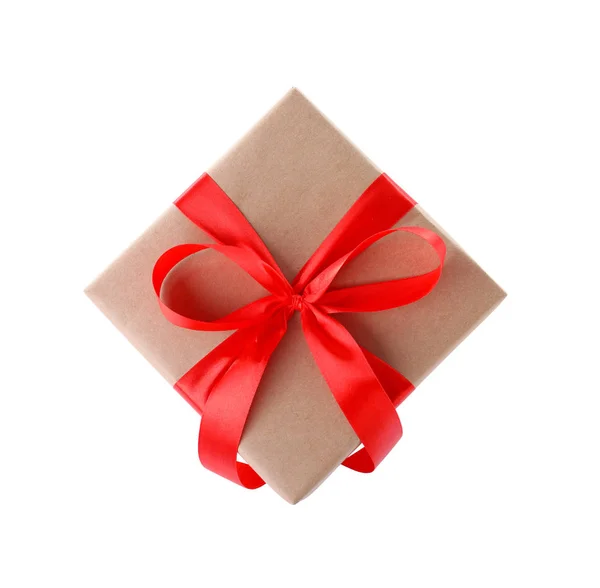Christmas gift box decorated with ribbon bow on white background, top view — Stock Photo, Image