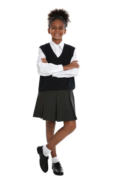 Heureuse fille afro-américaine en uniforme scolaire sur fond blanc — Photo