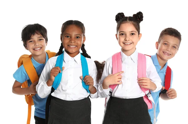 Niños felices en uniforme escolar sobre fondo blanco — Foto de Stock