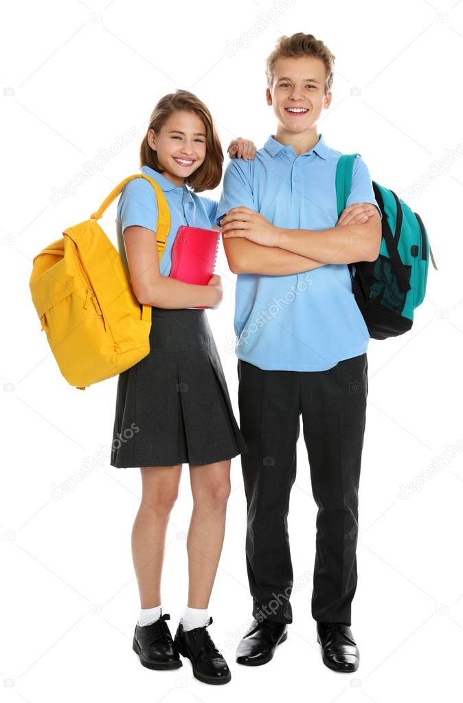 Happy pupils in school uniform on white background