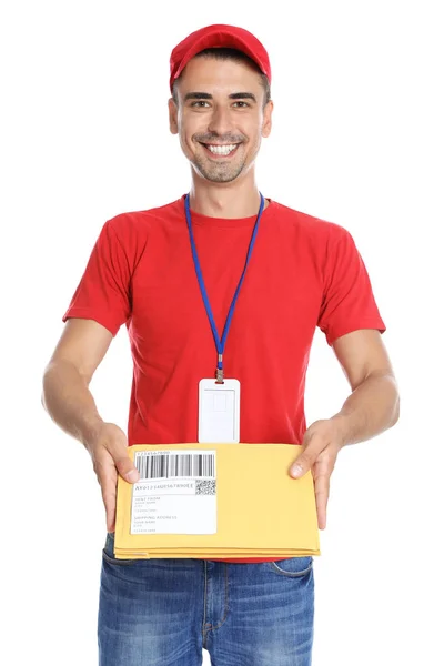 Happy young courier with envelopes on white background — Stok Foto