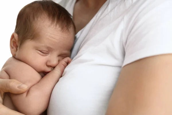 Young mother with her little baby on light background — Stock Photo, Image