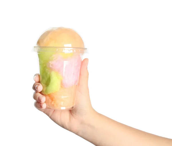 Young woman holding plastic cup with cotton candy on white background, closeup — Stock Photo, Image