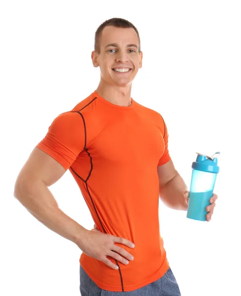 Athletic young man with protein shake on white background — Stock Photo, Image