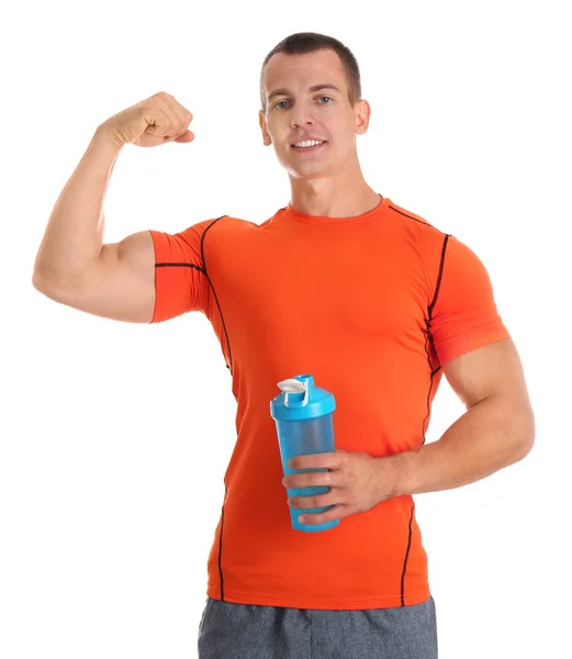 Athletic young man with protein shake on white background — Stock Photo, Image