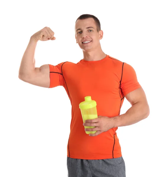 Athletic young man with protein shake on white background — Stock Photo, Image