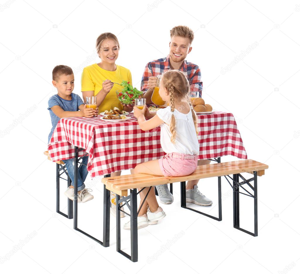 Happy family having picnic at table on white background
