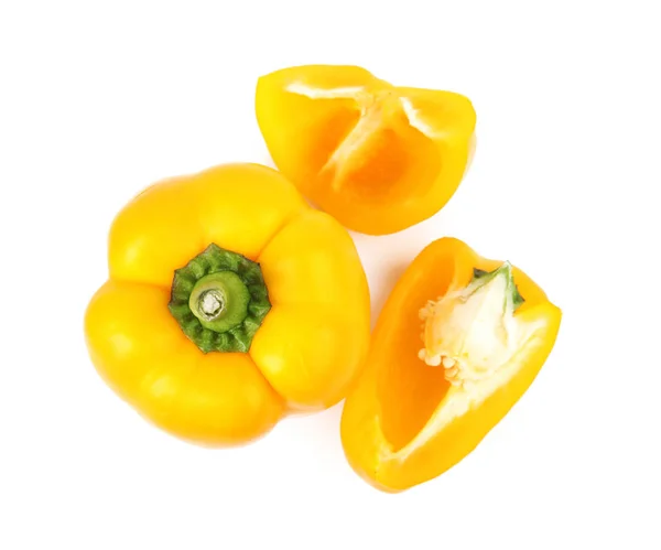 Whole and cut yellow bell peppers isolated on white, top view — Stock Photo, Image