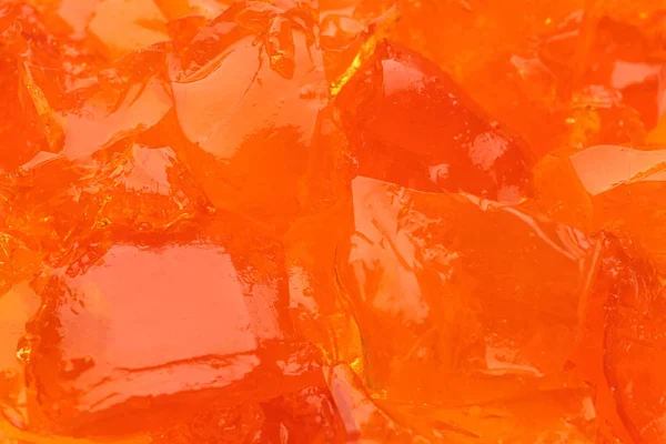 Gelatina di frutta gustosa arancione come sfondo, primo piano — Foto Stock