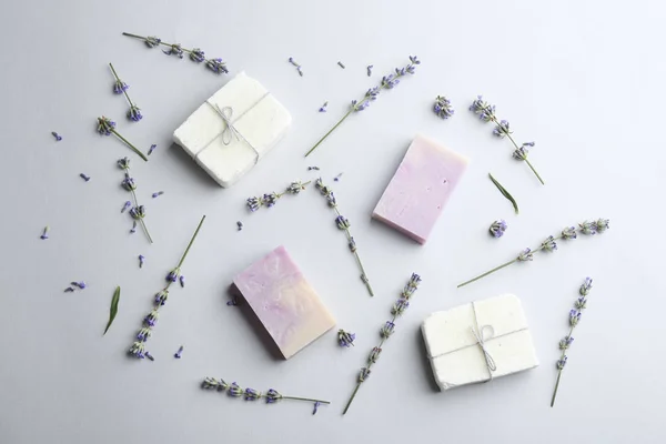 Hand made soap bars with lavender flowers on white background, top view — Stock Photo, Image