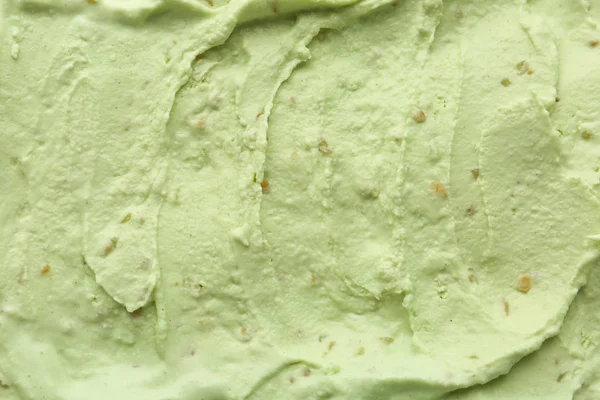 Delicious refreshing pistachio ice cream as background, closeup — Stok Foto