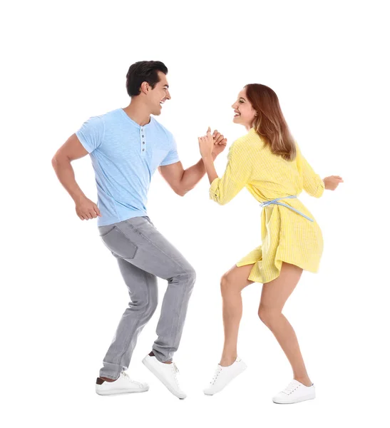 Hermosa pareja joven bailando sobre fondo blanco — Foto de Stock