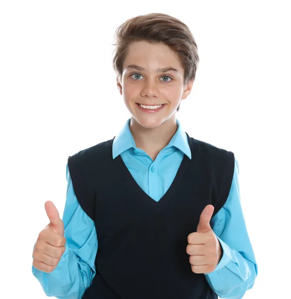 Lycklig pojke i skoluniform på vit bakgrund — Stockfoto
