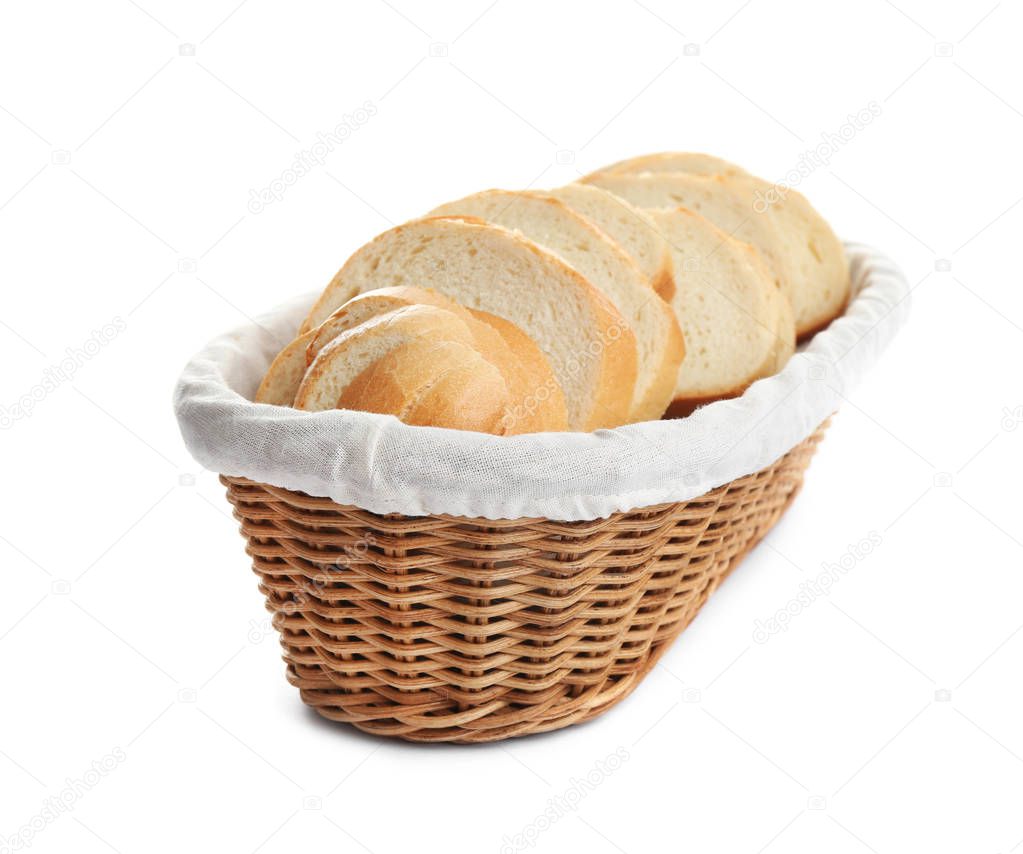 Slices of tasty fresh bread in wicker basket on white background