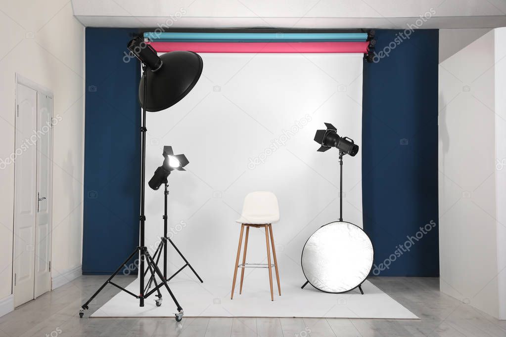 Photo studio interior with set of professional equipment