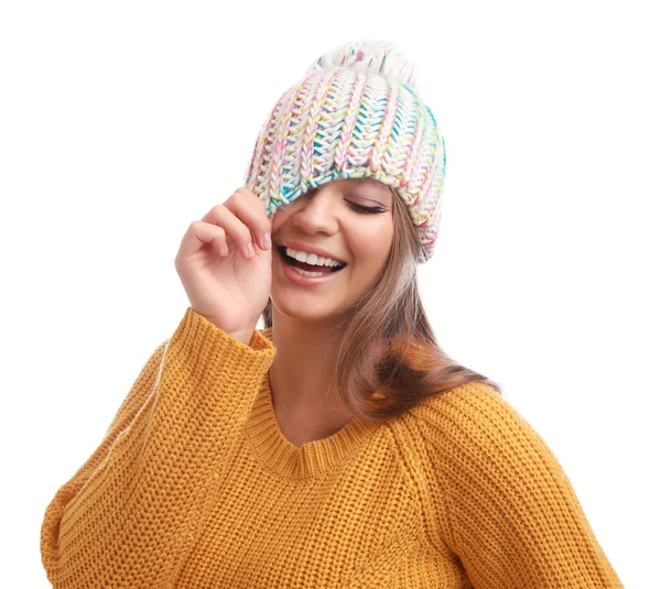 Funny young woman in warm sweater and hat on white background. Winter season — Stock Photo, Image