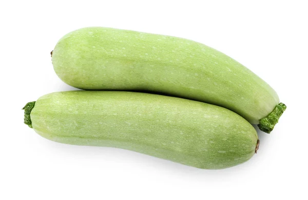 Frische reife Zucchini-Kürbisse auf weißem Hintergrund, Draufsicht — Stockfoto