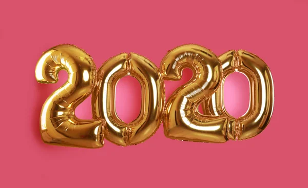 Globos dorados para decoración de fiestas sobre fondo rosa. 2020 Año Nuevo celebración — Foto de Stock