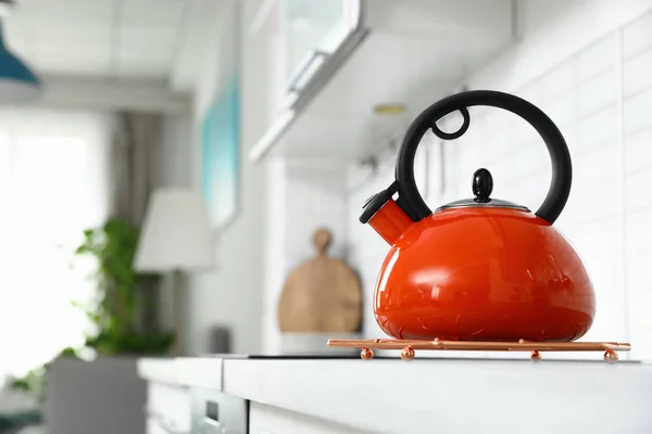 Modern kettle on kitchen counter indoors, space for text — Stock Photo, Image