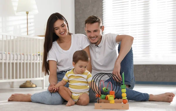 Happy family with adorable little baby at home — Stock Photo, Image