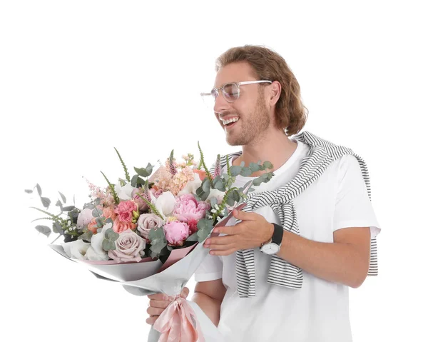 Jovem homem bonito com lindo buquê de flores no fundo branco — Fotografia de Stock