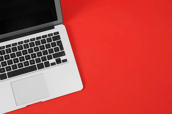 Modern laptop on red background, top view. Space for text — Stock Photo, Image