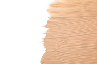 Beyaz arka plan üzerinde sıvı temel, üst görünüm. Makyaj ürünü