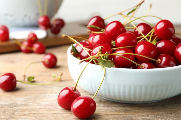 Bowl of delicious cherries on wooden table, closeup view. Space for text — Stock Photo, Image